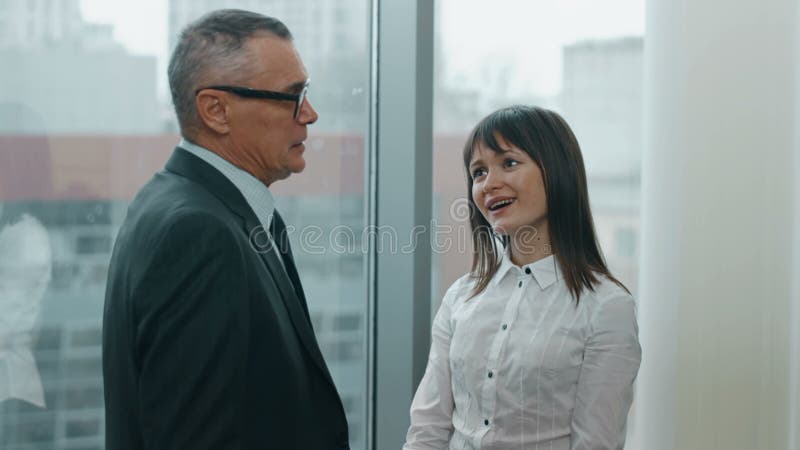 secretary and her boss flirting in office