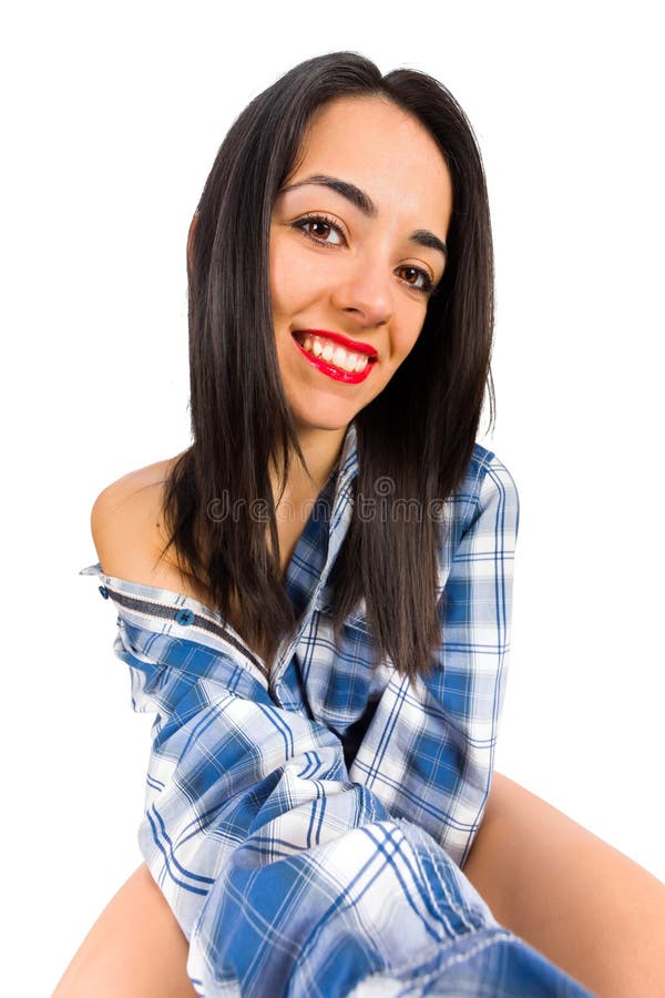 brunette lady taking selfies in man shirt - isolated image. brunette lady taking selfies in man shirt - isolated image.