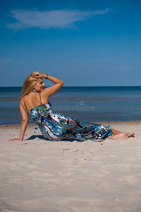 summer woman on the beach near a sea