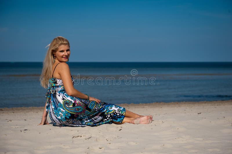 summer woman on the beach near a sea