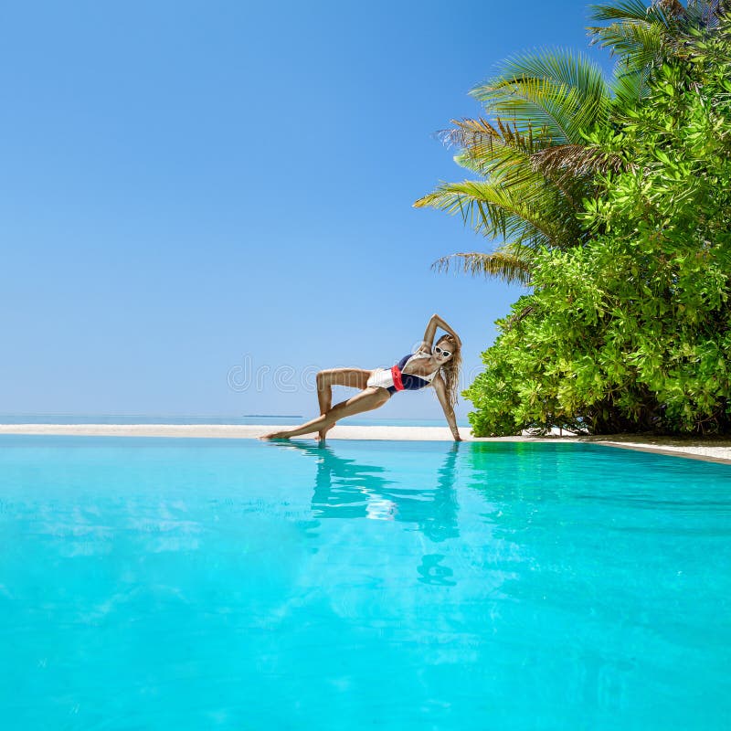 Woman In Bikini Near The Pool At Maldives Tropical Island Elegant Female Model In Fashionable