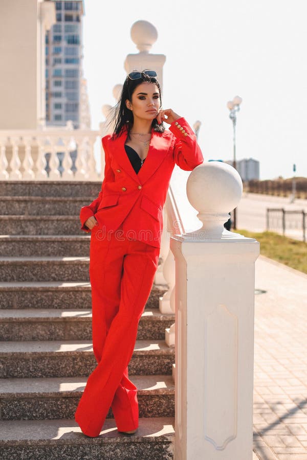 Woman with Dark Hair in Elegant Red Suit with Accessories Stock Image -  Image of blouse, model: 143440823