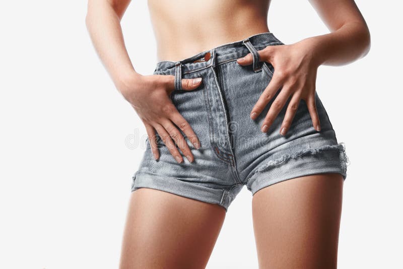 Attractive Girl In Denim Hot Pants And Half Sleeve Shirt Stock Photo, Royalty-Free