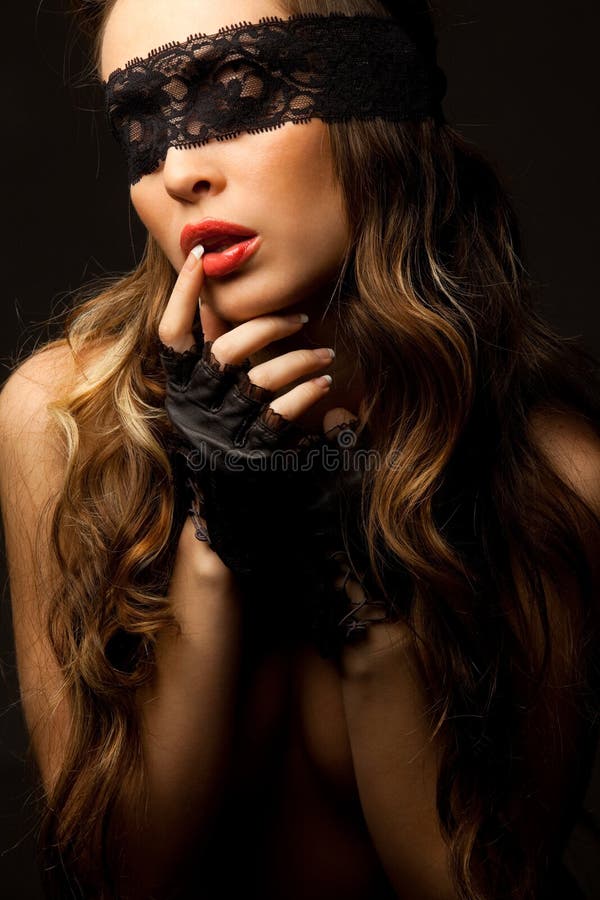 woman looking through black openwork lace