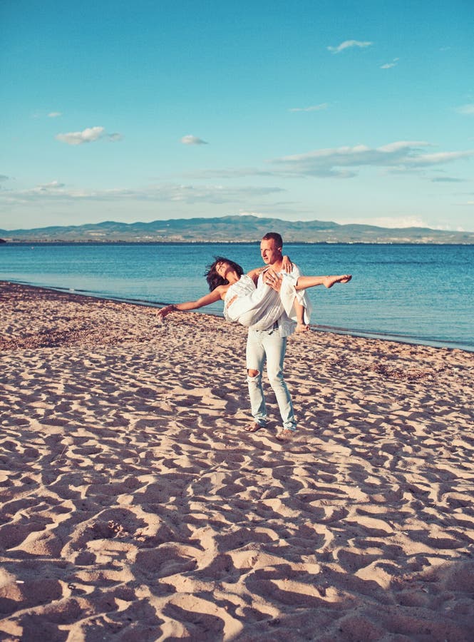 woman and man at sea. Family and valentines day. Love relations of couple enjoying summer day together. Couple in stock photo woman and man at sea. Family and valentines day. Love relations of couple enjoying summer day together. Couple in stock photo