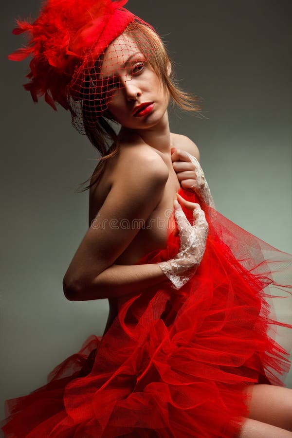 woman in red hat with net veil