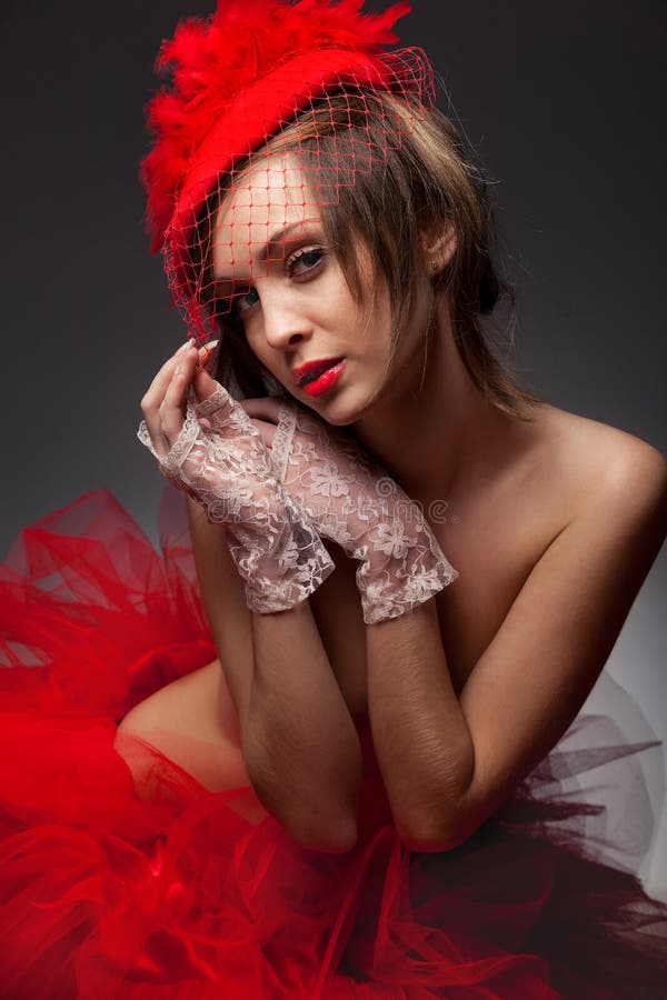 woman in red hat with net veil