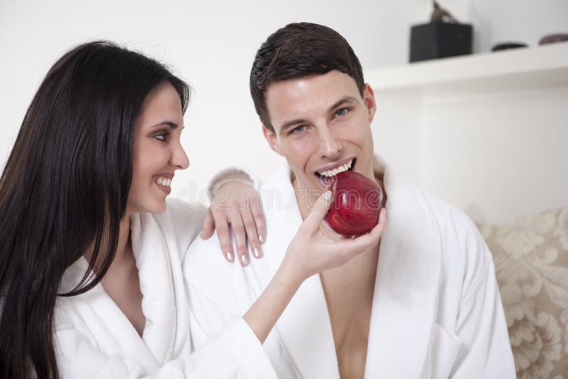 young couple in the morning with an apple