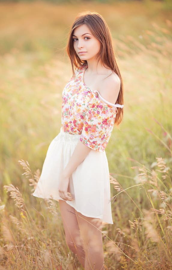 Young woman in a field royalty free stock photography