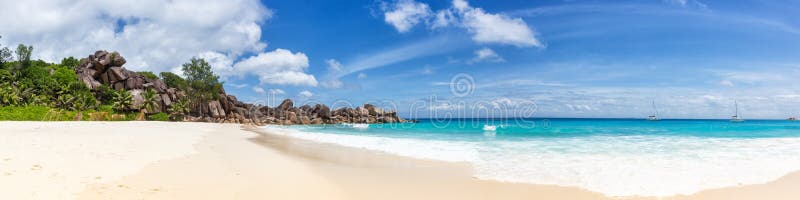 Seychelles Grand Anse beach La Digue island panoramic panorama view vacation holidays travel traveling. Waves