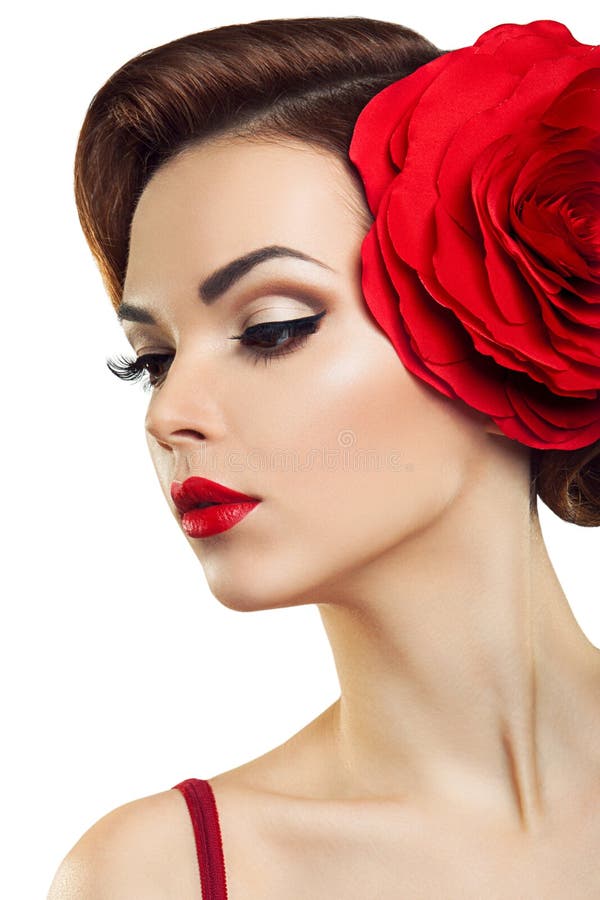 Señora apasionada con una flor roja en su pelo. imagenes de archivo Señora apasionada con una flor roja en su pelo. imagenes de archivo