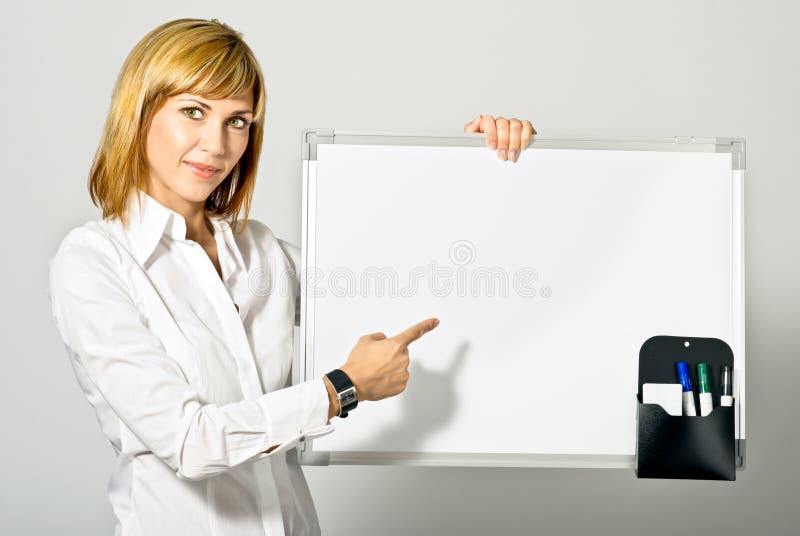 Señora del asunto que señala a Whiteboard fotos de archivo Señora del asunto que señala a Whiteboard fotos de archivo