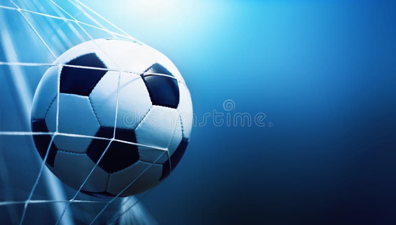 Soccer ball in goal on blue background. Soccer ball in goal on blue background