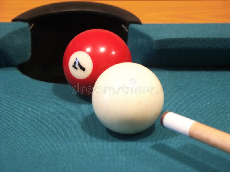 Billiard balls on green table with cue. Billiard balls on green table with cue