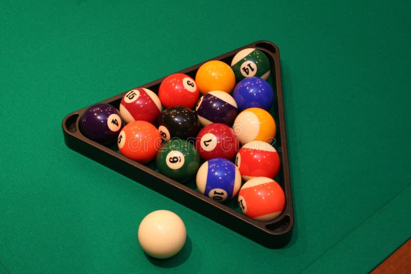 Pool billiard balls on a green table. Pool billiard balls on a green table