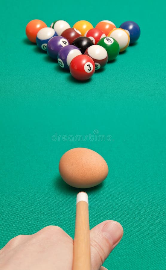 Blow chicken egg on the billiard balls. Blow chicken egg on the billiard balls