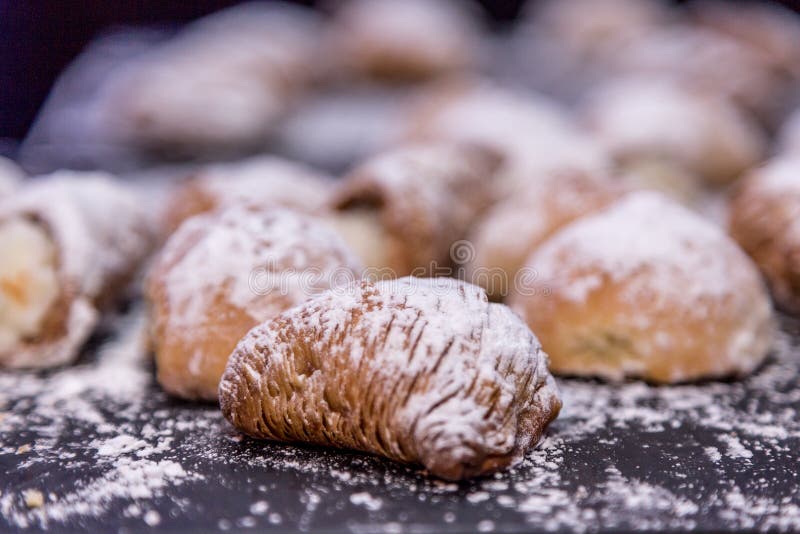 Sfogliatella, typical Neapolitan pastry with yellow cream, Naples, Italy. Sfogliatella, typical Neapolitan pastry with yellow cream, Naples, Italy