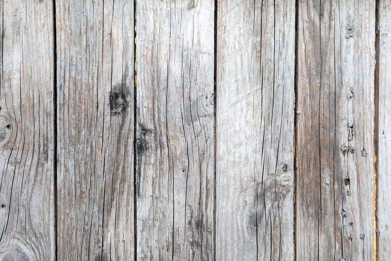 Sfondo di legno antico con pannelli a strisce verticali e chiodi arrugginiti fotografia stock libera da diritti Sfondo di legno antico con pannelli a strisce verticali e chiodi arrugginiti fotografia stock libera da diritti