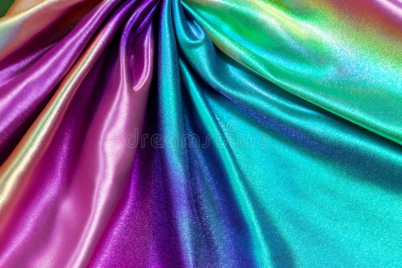 Sfondo di tessuto iridescente. madre lucida di tessuto di perle, tessuto multicolore luminoso.