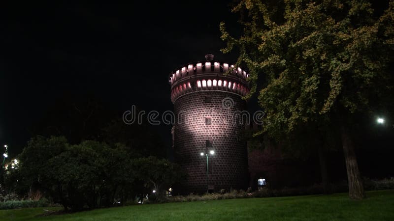 The Sforza Castle at night, a journey through time between walls and towers