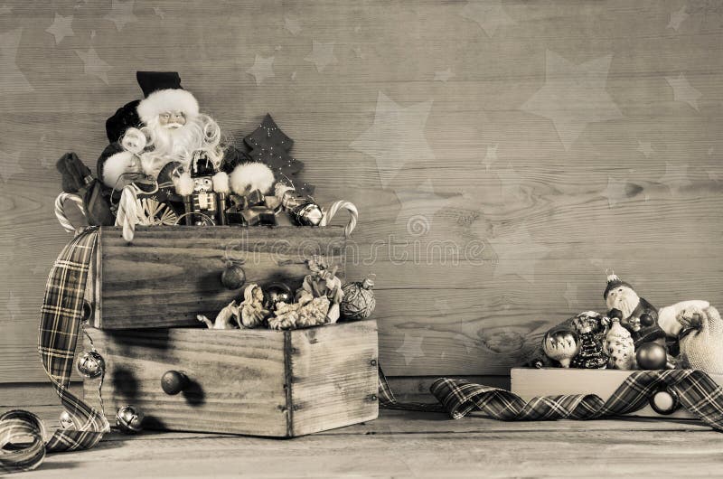 Shabby chic wooden grey christmas background with Santa decoration.