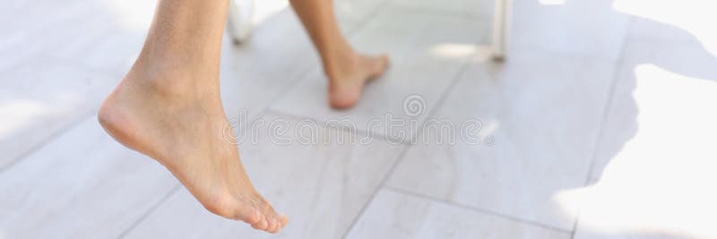Close-up of persons feet step on tile near pool, barefoot man with hairy legs. Tanned body skin, enjoy summer vacation, hot days. Holiday, resort, summertime, chill concept. Close-up of persons feet step on tile near pool, barefoot man with hairy legs. Tanned body skin, enjoy summer vacation, hot days. Holiday, resort, summertime, chill concept