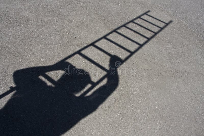 Shadow of man climbing ladder