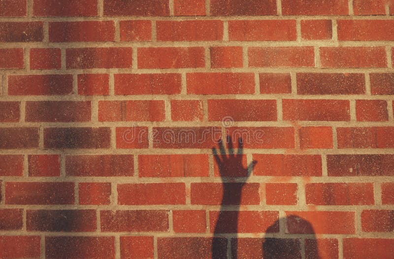 Shadow of Outstretched Arm Against Brick Wall Stock Image Image of