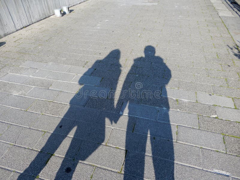 Shadows of a couple, man and woman holding hands royalty free stock images Shadows of a couple, man and woman holding hands royalty free stock images