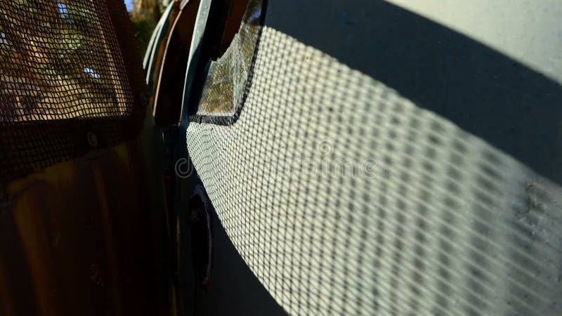 Shadows Creep Along Abandon Bus in the Mojave Desert