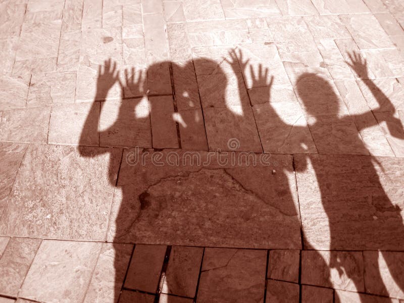 Shadows of three people royalty free stock image