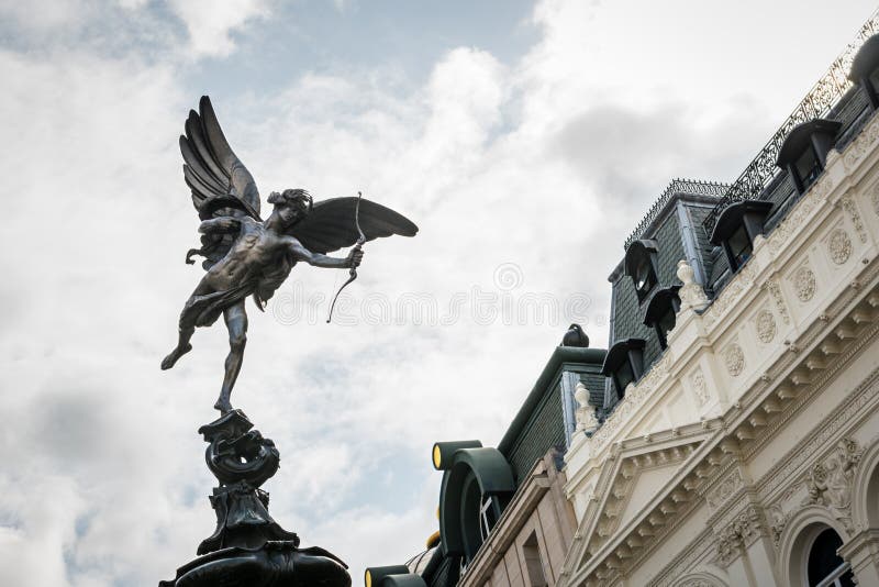 Low-angle view of the Shaftesbury Memorial Fountain in Piccadilly Circus in London, also known as Eros, erected and unveiled in 1893. Low-angle view of the Shaftesbury Memorial Fountain in Piccadilly Circus in London, also known as Eros, erected and unveiled in 1893