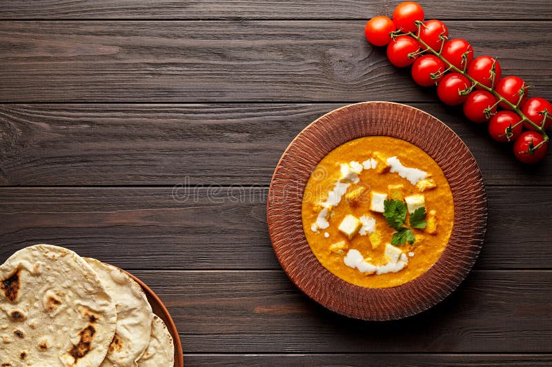 Shahi paneer traditional Indian vegetarian gravy meal with vegetables and butter paneer cheese