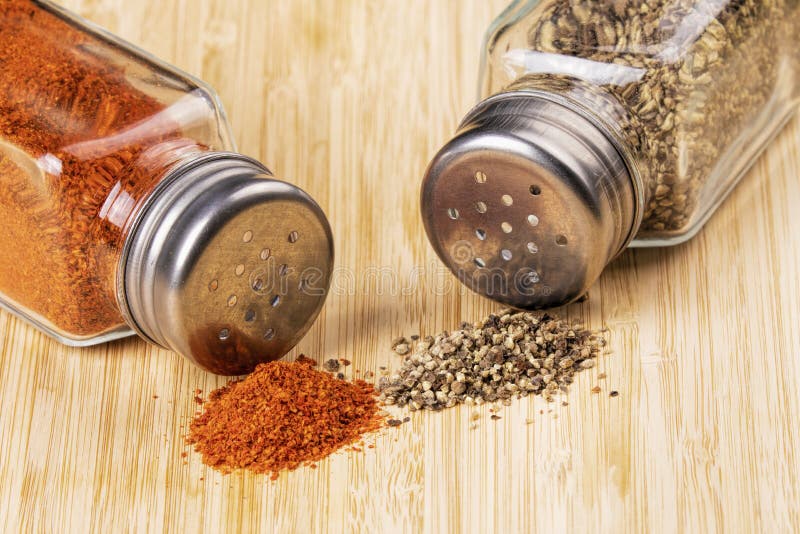 Shakers Full of Black Pepper and Paprika on Wooden Background Stock Photo -  Image of close, shaker: 165134768