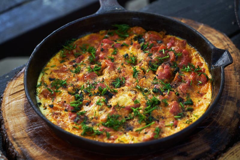 Shakshuka Breakfast with Fried Egg and Tomato in a Pan Stock Photo