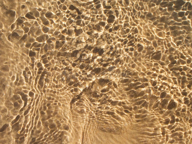 Shallow water at the beach stock image