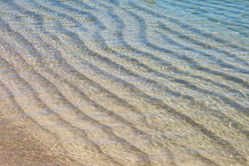 Sand Waves In Shallow Water Stock Photo - Image of contour, texture ...