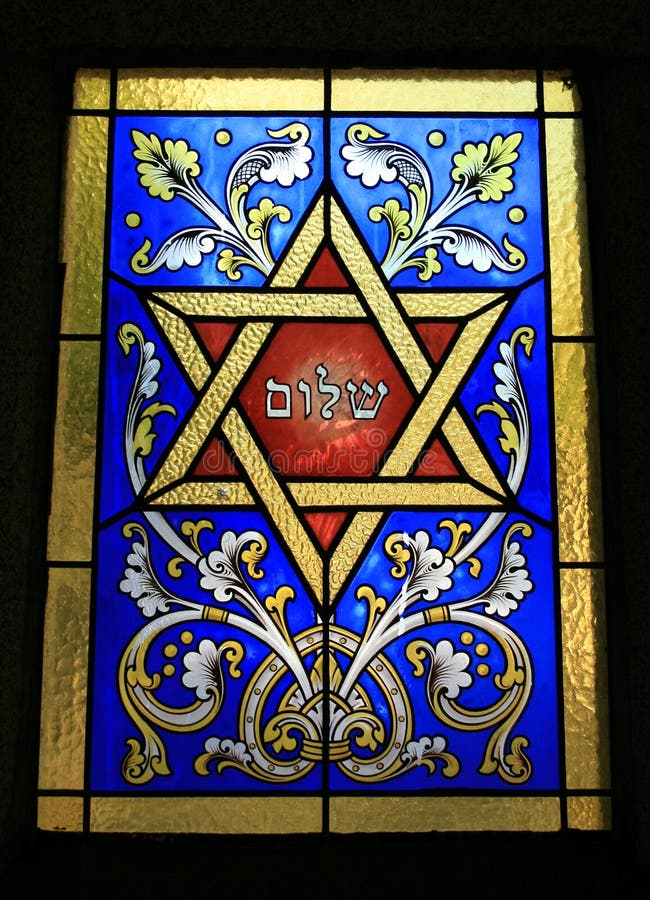 Star of David and Shalom written with hebrew letters on a stained glass window.