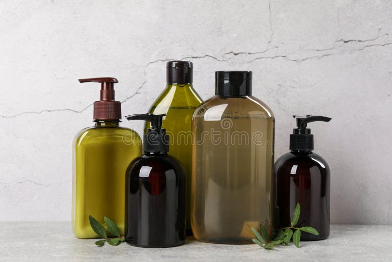 Shampoo Bottles and Leaves on Light Grey Table Stock Image Image of