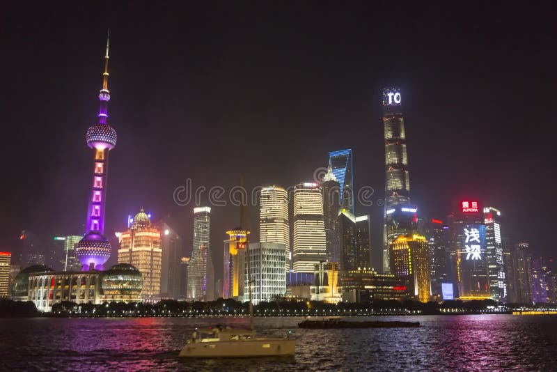 Shanghai night skyline. The Oriental Pearl Radio & TV Tower is a TV tower in Shanghai. Its location at the tip of Lujiazui in the Pudong New Area by the side of royalty free stock image Shanghai night skyline. The Oriental Pearl Radio & TV Tower is a TV tower in Shanghai. Its location at the tip of Lujiazui in the Pudong New Area by the side of royalty free stock image
