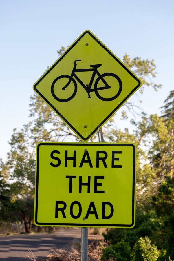 Share the Road with a Bike Sign Stock Image - Image of yellow, black