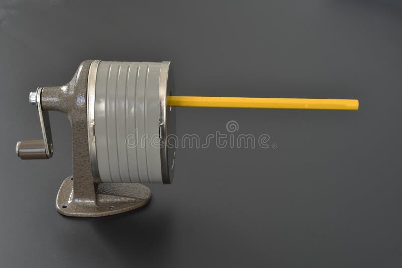 Pencil sharpener with pencil ready to be sharpened. Pencil sharpener with pencil ready to be sharpened