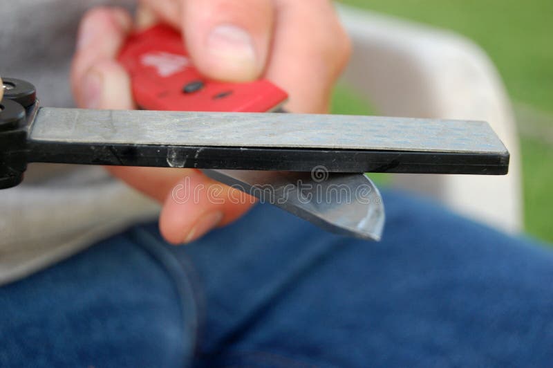 Sharpening a Pocket Knife stock image. Image of edge 72497077