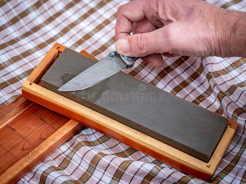 Pocket Knife with Unique Damascus Patter Getting a Sharpened Stock