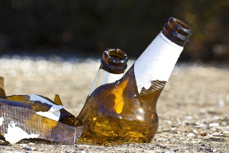 Shattered Beer Bottle Resting on the Ground Alcoholism Concept Stock Image Image of