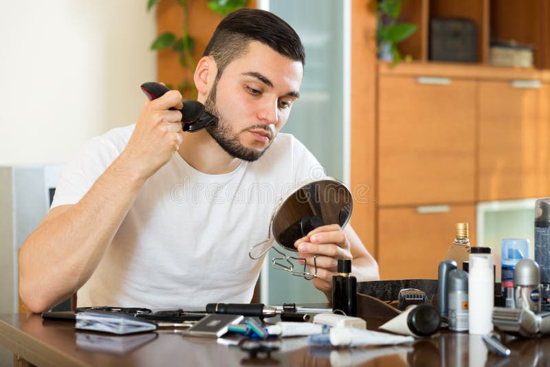 Shaving Beard with Electric Razor Stock Photo Image of home, mirror