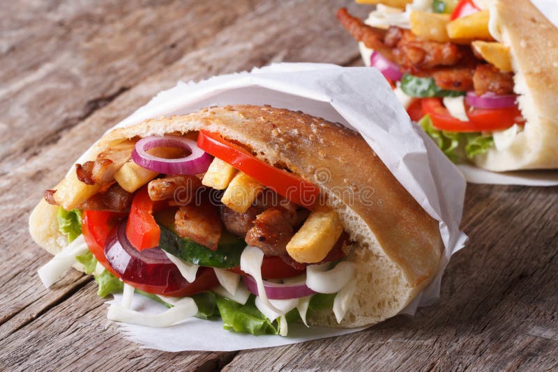 Shawarma in Pita Bread Closeup on the Table Horizontal Stock Photo