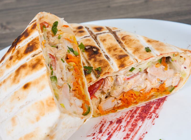 Shawarma in Thin Pita Bread with Chicken and Vegetables Stock Photo