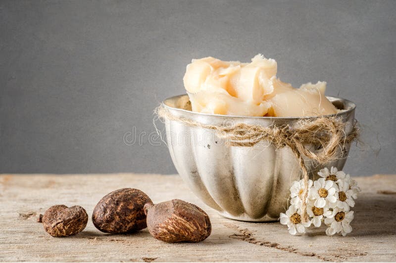 Shea Butter and nuts stock photography