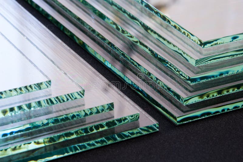 Sheets of Factory manufacturing tempered clear float glass panels cut to size royalty free stock photography Sheets of Factory manufacturing tempered clear float glass panels cut to size royalty free stock photography